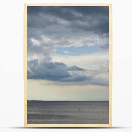 Overcast weather with clouds on blue sky over river coastline