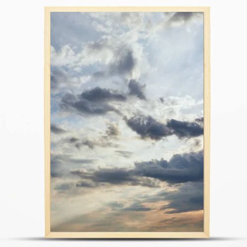 dark clouds and sun rays on blue sky background