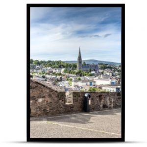 Londonderry, Northern Ireland: Skyline of Derry with St. Eugene's Cathedral near Free Derry Corner, city wall. horizon and blue sky