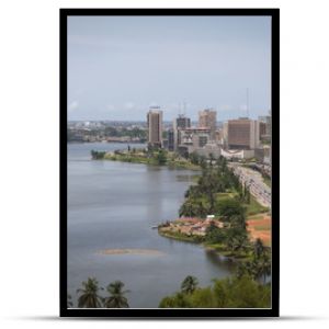 Abidjan, the economical capital of Ivory Coast (Cote d'Ivoire), it's business area Plateau with the Atlantic ocean bay in the background. April 2013