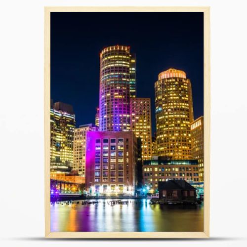 The Boston skyline and Fort Point Channel at night from Fan Pier