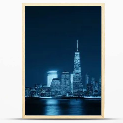 New York City skyline with skyscrapers over Hudson River viewed from New Jersey at night