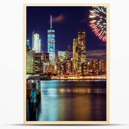 Firework over city at night with reflection in water