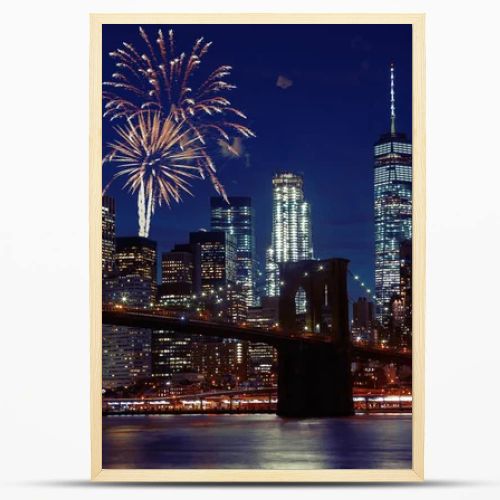 Fireworks over New York City skyline and Brooklyn Bridge