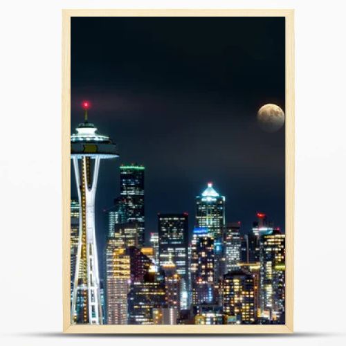 Full moon rises above Seattle skyline, as viewed by night from Kerry Park.