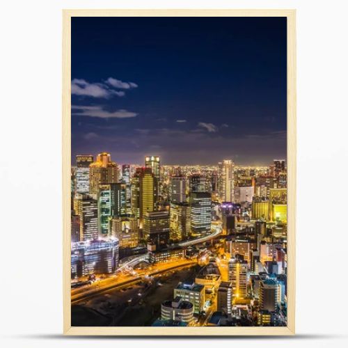 Aerial view of the Osaka cityscape at night from the observation platform at the Umeda sky building.
