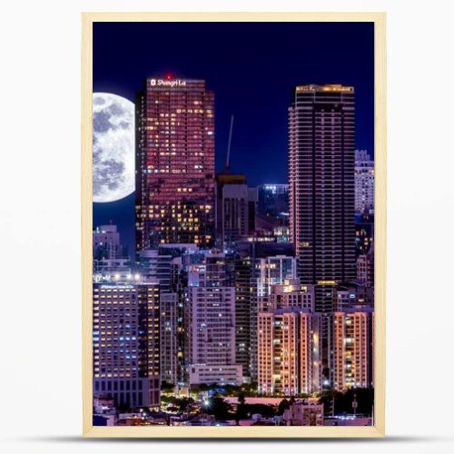 Metro Manila - Evening shot of Bonifacio Global City as seen from Makati. Full Moon behind beautiful skyline