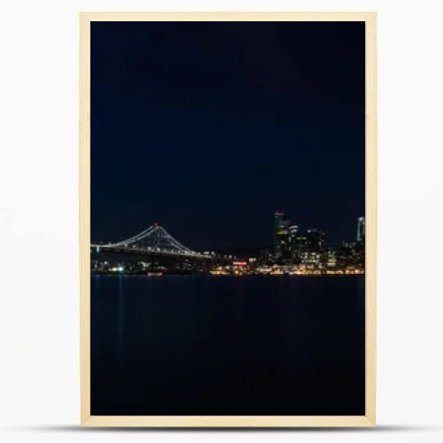 Light illuminates the beautiful Northern California city of San Francisco at night. This scenic, modern metropolis is located on the edge of the Pacific Ocean and just west of the city of Oakland.