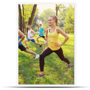 Group of young people training in park