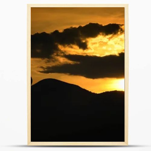 Silhouette of biker at sunset