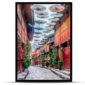 Early morning streets and oil-paper umbrellas in Dayan Old Town, Lijiang, Yunnan, China