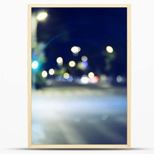 Blurred street at night time. Vintage looking shot made with old lens