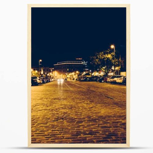 Cobblestone street in Fells Point at night, Baltimore, Maryland.