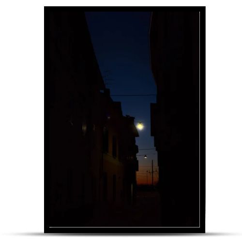 Sky at sunset in autumn framed by buildings