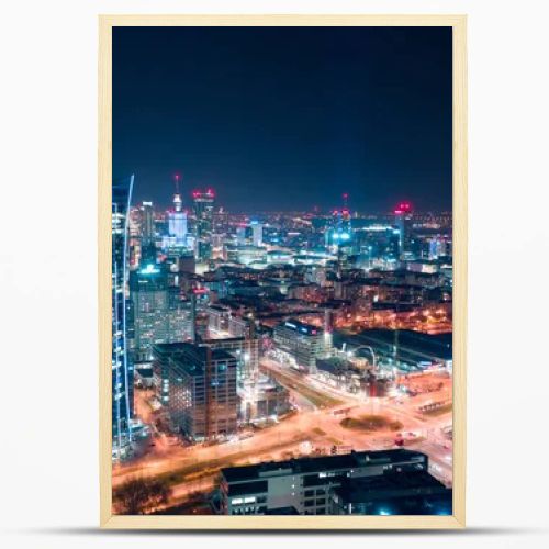 Aerial view of Warsaw business center at night: skyscrapers and 