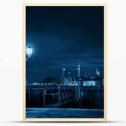 Venice at night with street lamp and San Giorgio Maggiore church in Italy.