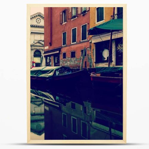 beautiful canal with boats in Venice