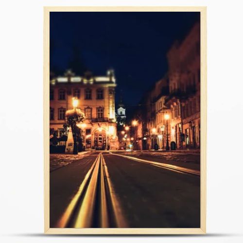 Old European city pedestrian street night city lights. Old architeccture illuminated street