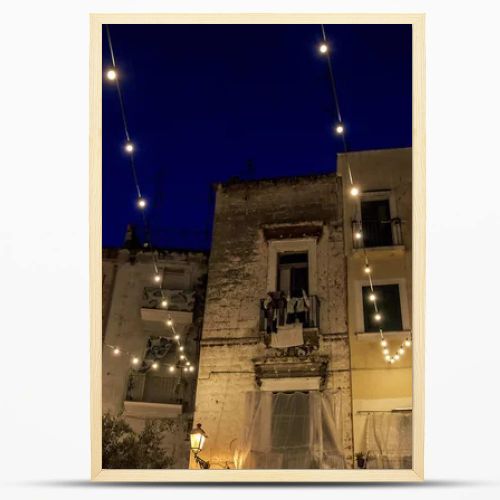 Night view in amazing Old Town , historical center of Bari , Italy. Street Casamassimi .