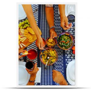 Male and female serving food on table during weekend