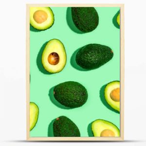 Fresh avocado pattern on a green background flat lay