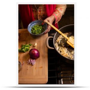 Indian woman's hands working in the kitchen preparing food