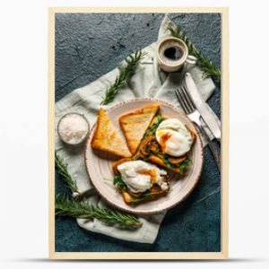 Plate with tasty egg Benedict and cup of coffee on black background