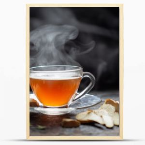 Hot Ginger tea in a glass on wood background.Hot drink . Copy space.