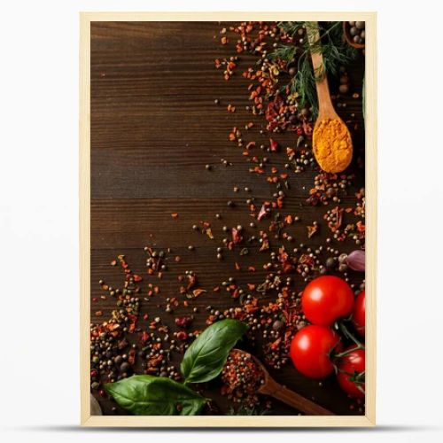 Different cooking ingredients and spices on wooden background