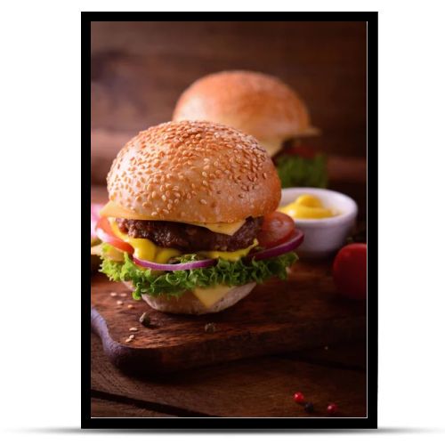 Fresh burger closeup. Wooden rustic background. Top view