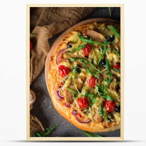 Pizza with chicken, arugula, cheese and onions on wooden rustic table. Top view