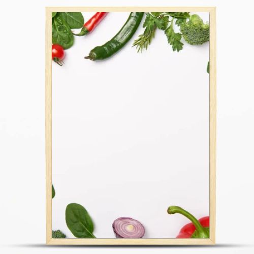 Flat lay with organic vegetables on white background