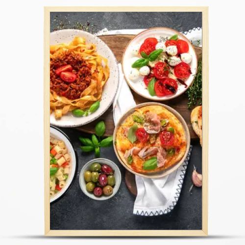 Italian food dishes on dark background. Traditional food concept. Top view.