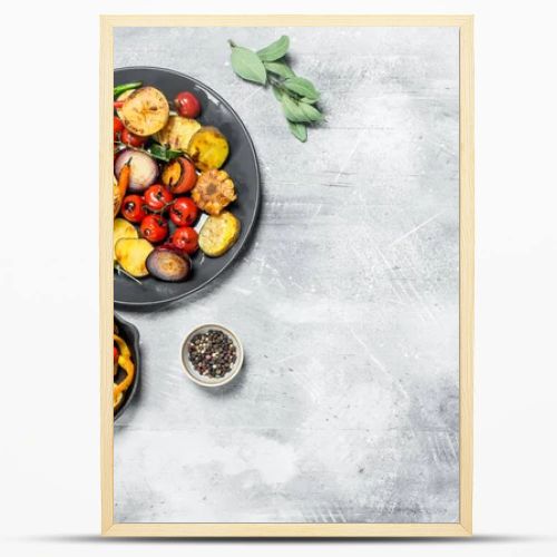 Various grilled vegetables with spices and herbs. On a rustic background.
