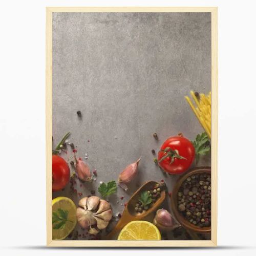 Italian food background on stone table. Macaroni, basil and vegetables.
