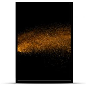 Closeup of orange powder particle splash isolated on black  background.