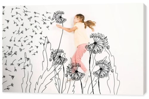 top view of kid blowing dandelion seeds while flying on white 