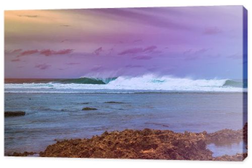 Beautiful sea landscape in early sunset on the background of dramatic cloudy sky and corals. Siargao island, Philippines.