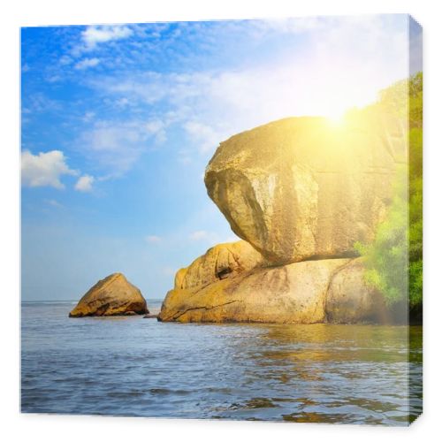 A picturesque cliff on the shore of a tropical sea.