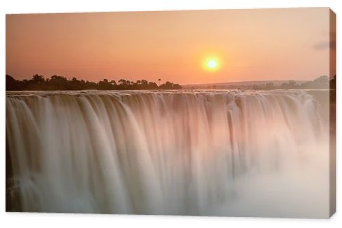 Beautiful sunrise over waterfall