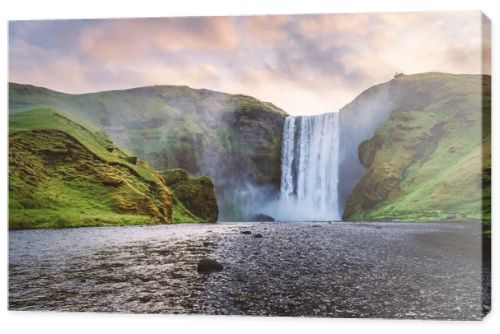 Famous Skogafoss waterfall on Skoga river in sunrise time