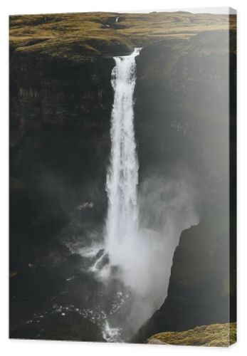 dramatic Haifoss waterfall and rocky cliff, Iceland