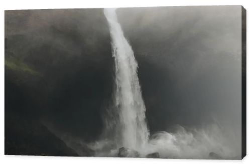 bottom view of Haifoss waterfall with mist around, Iceland