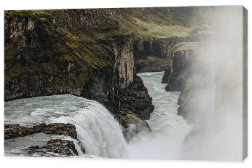aerial view of beautiful Gullfoss waterfall flowing through highlands in Iceland