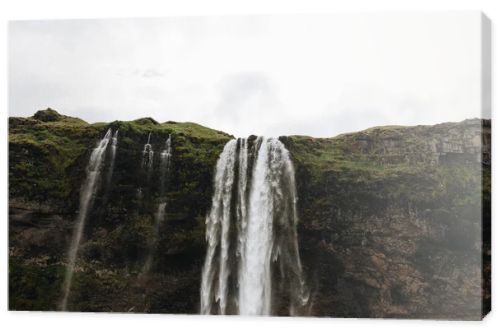 low angle view of Seljalandsfoss waterfall in highlands in Iceland 