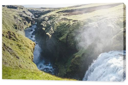 aerial view of waterfall on Skoga river flowing through highlands in Iceland