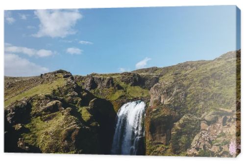 aerial view of landscape with Skoga river and mountain under bright blue sky in Iceland