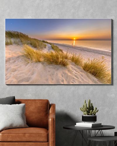 Sunset View over ocean from dune over North Sea and Canal in Ouddorp, Zeeland Province, the Netherlands. Outdoor scene of coast in nature of Europe.