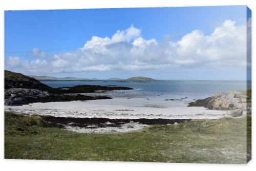 Beautiful sandy beach with coastal dunes on the remote island of South Uist in the Outer Hebrides of Scotland.