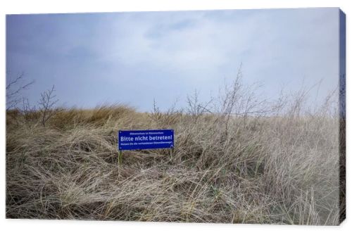 Norddeich, Germany.  March 24, 2026. Landscape scene at the Northsea coast in East Frisia. Lettering in German which means -Probibited to walk on the dunes- . Editorial and documentary use only